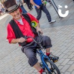 Circus Skills Workshop Hire with a professional riding a childrens penny farthing at a community fun day