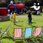 Children at a fun day playing with the Hoola Hoops from the Circus Skills Workshop Hire