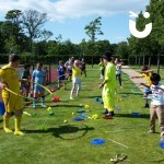 Circus Skills Workshop Hire teaching children how to hula hoop at a school fun day
