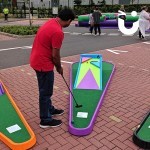 Man putting on hole 6 of our crazy golf