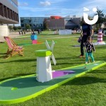 Crazy Golf at a Corporate Family Fun Day being enjoyed by father and daughter