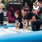 Curling Lane at community even being enjoyed by father and son
