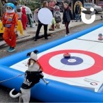 Curling Lane at a community event / street party with an interested dog and people in costumes