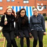 Three Universitie students relaxing on our Giant Deckchair Hire