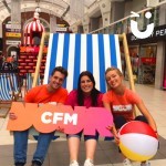 Three clients sitting on our Giant Deckchair Hire whilst promoting their own company