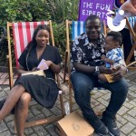 Deckchairs at a family fun day with a young family sitting comfortably