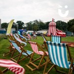 Deckchairs at a corporate family fun day along with a helter skelter slide