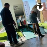 Putting Golf being enjoyed at an office fun day
