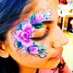 Girl with pink flowers from the Adult Face Painting Hire