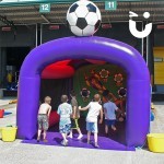 cHILDREN PLAYING ON THE Football Shoot Out Inflatable Hire