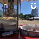 Candy Floss And Popcorn On A Cart artisitc shot looking through the cart at a building