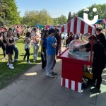 Candy Floss And Popcorn On A Cart 7 Hire at a school event set up outside with students waiting for a portion of sweet treats