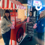 Colleagues helping themselves to Pick N Mix from our traditional cart