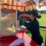 Fun Expert Jenny serving popcorn from our traditional cart