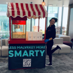 Fun Expert Jenny posing with the branded traditional Popcorn Cart