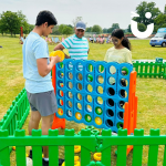 Family playing a game of Giant Connect 4
