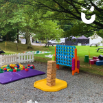 Range of Giant Games set up on a mix of gravel and grass