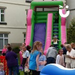 People lining up to have a go on the Giant Inflatable Slide Hire