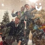 Christmas Giant Snow Globe Hire at a football event being enjoyed by 3 men and a mascot!