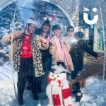 Christmas Giant Snow Globe Hire 3 with 3 woman smiling and posing for a photo with the prop snowman