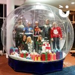 People posing inside the Snow Globe Hire