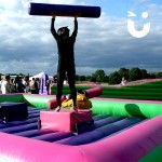 A guest celebrates being the winner of the Gladiator Joust Hire