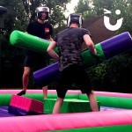 Two adults on the Gladiator Joust