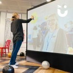 Digital Graffiti Wall hire at a corporate conference being enjoyed by a budding artist