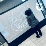Digital Graffiti Wall being drawn on at a University conference