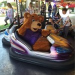 Dodgems Hire 2 at a fun day being used by children and Fun Bear