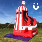 The Helter Skelter Slide Hire set up in a sunny field