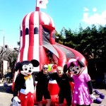 Mickey, Minny and some Fun Experts in front of the Helter Skelter Slide Hire