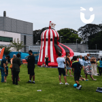Helter Skelter Slide Inflatable Hire at a busy fun day