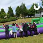 Guests watching the Human Table Football Hire  from the side lines