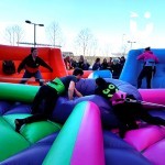 Teenagers competing on the Hungry Hippos Inflatable Hire