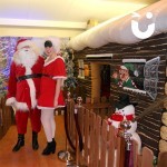 Mr and Mr's claus by the Inflatable Santa's Grotto 