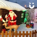 Inflatable Santa's Grotto with santa stood by the reindeer
