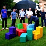 teams with the giant puzzle cube