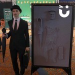 A guest poses next to the Giant Pin Art in his bowler hat and tie, having struck a pose in the Pin Art