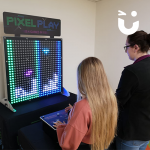 Two girls competing on the Pixel Play Hire