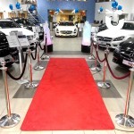 The Red Carpet And Stancions 4m Hire inside a car show room 