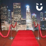 The Red Carpet And Stancions 4m Hire in front of a city skyline