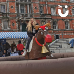 Royal Holloway student riding the Rodeo Reindeer