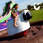 Young girl having a go on the Rodeo Sheep Hire