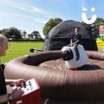 Young boy on the Rodeo Sheep Hire during an outdoor family fun day