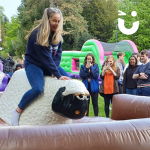 Student riding the Rodeo Sheep