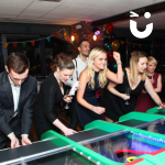 Guests playing on the Roll a Ball Derby during a corporate Christmas Event