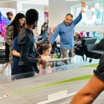 Scalextric Track Hire for a Corporate event with a young family cheering