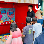 Children lining up for a turn on our Shoot The Hoop Side Stall