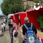 Cactus Stoss Stall Hire at a community event set up in a town centre with families having a turn